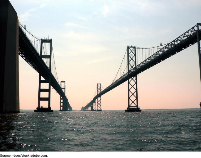 Two bridges extending over a body of water