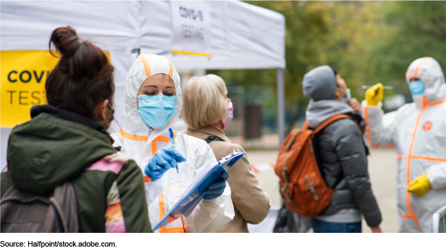 People at an outdoor COVID-19 testing site