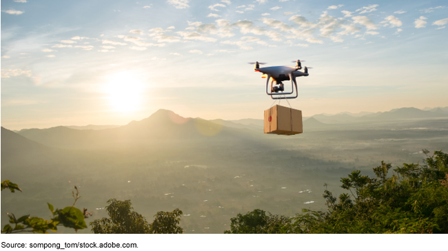 Illustration showing a drone carrying a package over a forested area with mountains in the distance. 