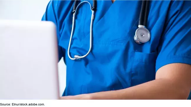 Telehealth --photo of doctor working at a computer laptop