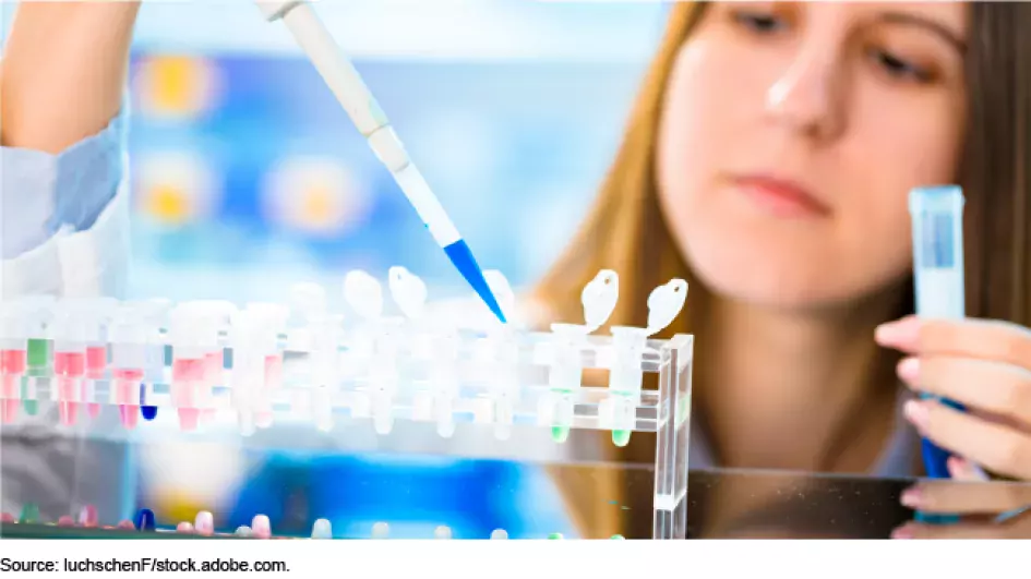 Photo showing a woman filling medical test tubes using a droplet syringe 