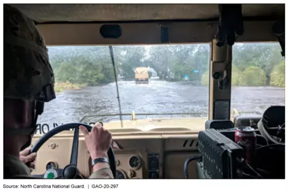 Photo of inside of a military vehicle in flooded area.