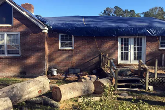 Photo showing damage to a home after storm