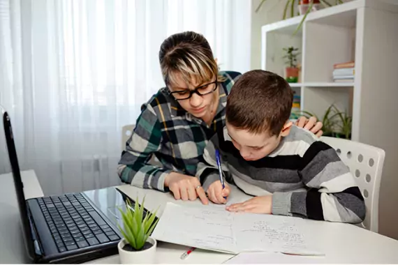 Image showing mother and son learning remotely