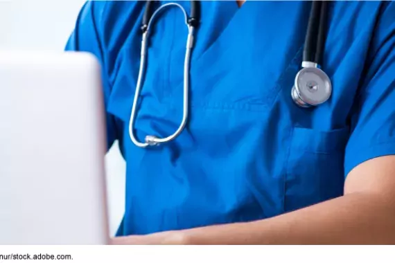 Telehealth --photo of doctor working at a computer laptop